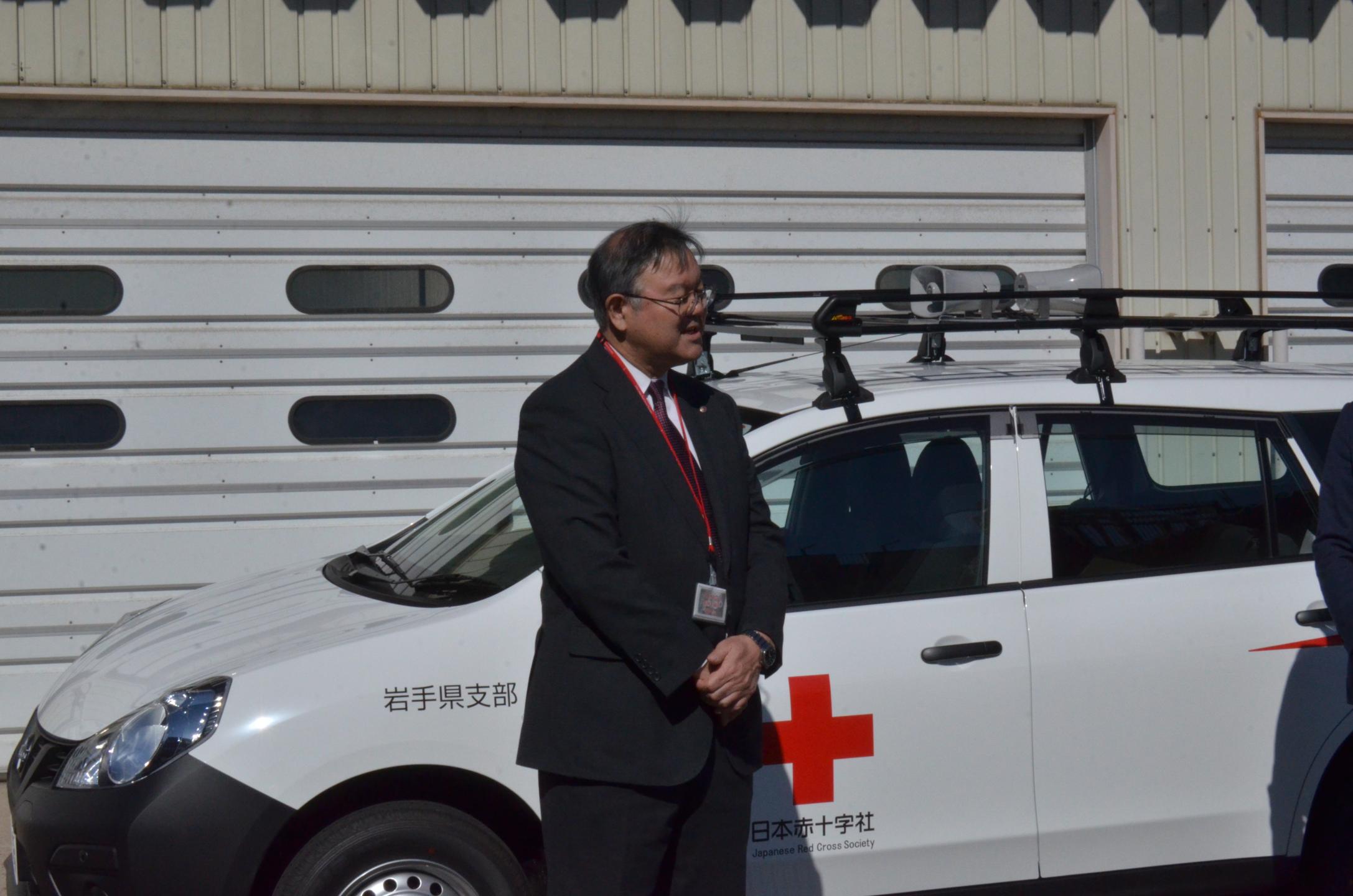 挨拶をする岩手県支部事務局長
